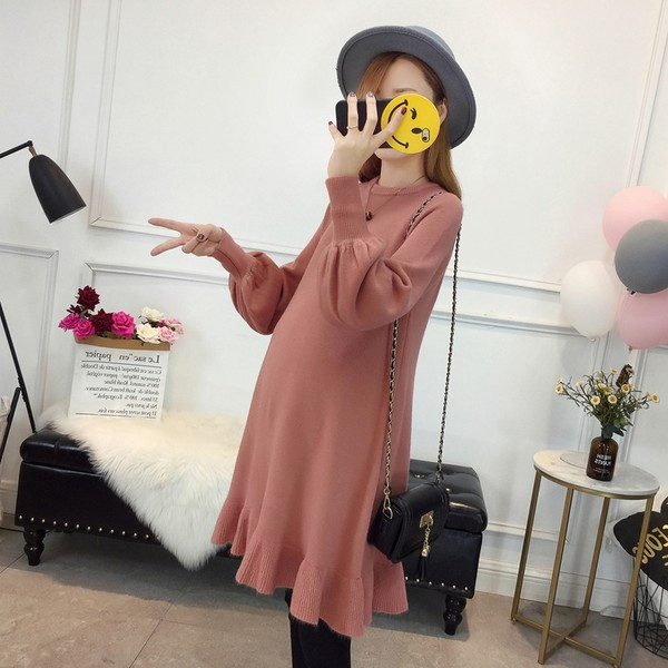 Hosszú kötött tunika fürtökkel terhes nők számára