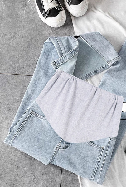 Új modellű női vékony szabású kismamafarmer, hasítékkal