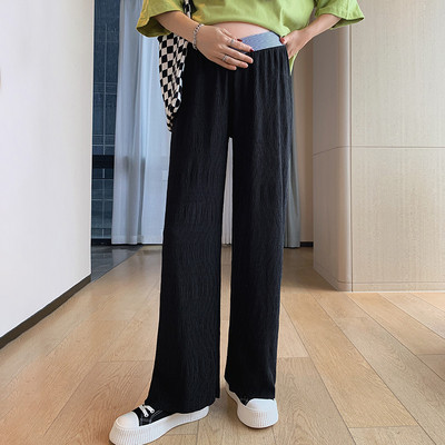 Vágott kismamanadrág alacsony elasztikus derékkal