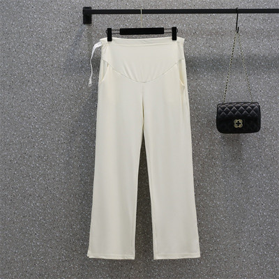 Elegáns női kismamanadrág hasítással