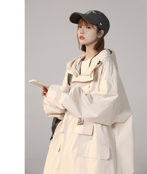 Női széles kabát cipzárral és zsebbel