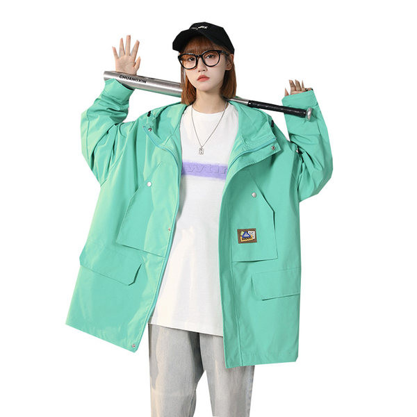 Női széles kabát cipzárral és zsebbel