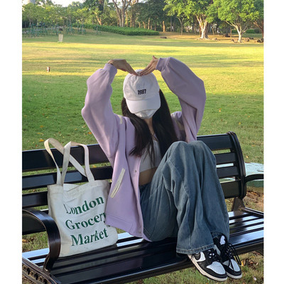 Alkalmi női kabát zsebbel és gombokkal