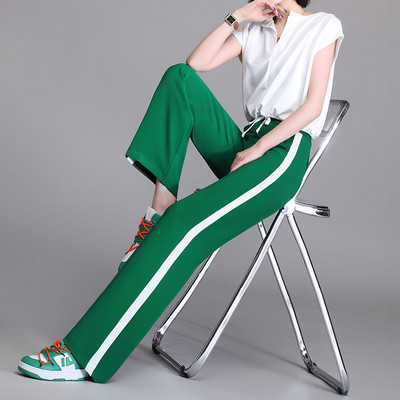 Hosszú, elegáns női nadrág szegéllyel és zsebbel