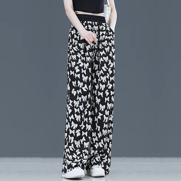 Lezser széles szárú női nadrág dekoratív virágokkal