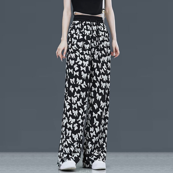 Lezser széles szárú női nadrág dekoratív virágokkal