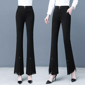 Divatos női hosszú nadrág, magas derékkal és dekoratív övvel