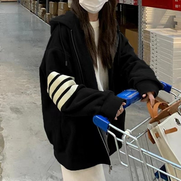 Bő fazonú női kapucnis pulóver cipzárral