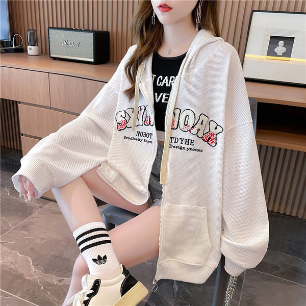 Ženska majica s printom i kopčanjem na zip