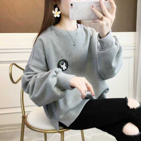 Női O-nyakú pulóver logóval