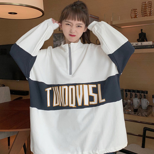 Női pulóverek - bő mintás cipzárral