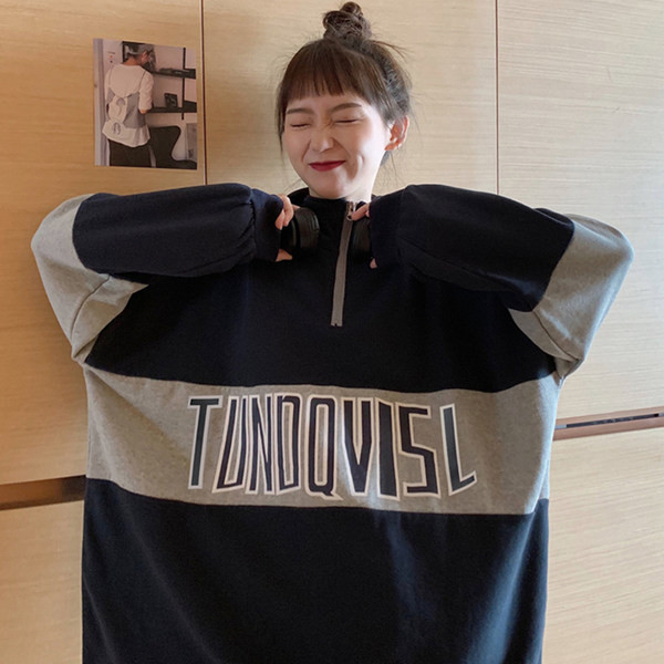 Női pulóverek - bő mintás cipzárral