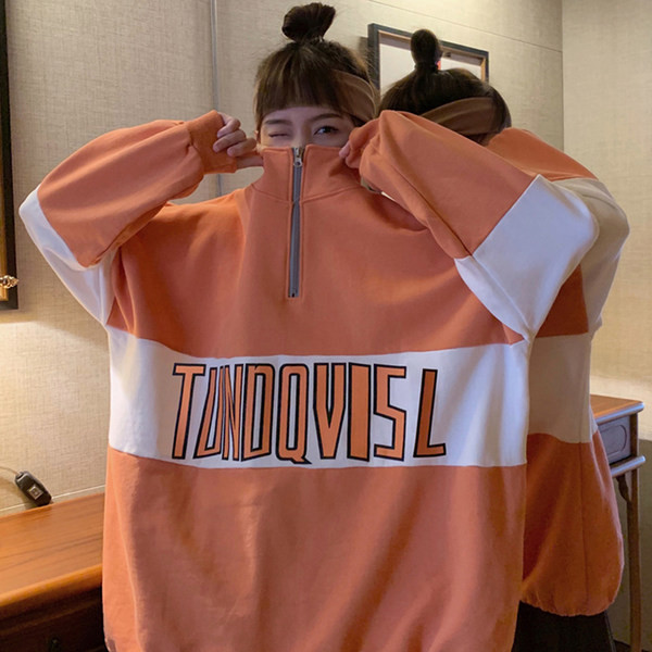 Női pulóverek - bő mintás cipzárral