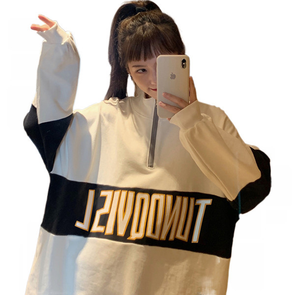 Női pulóverek - bő mintás cipzárral