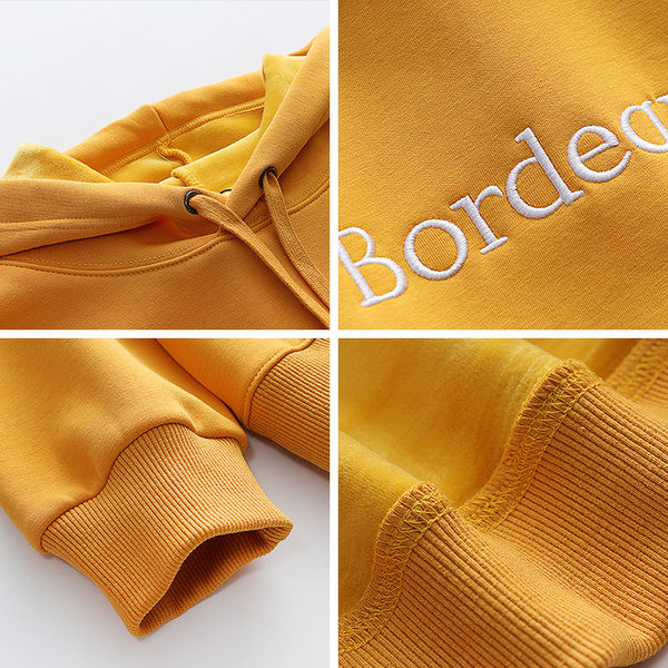 Naiste kapuutsiga dressipluusid kollast värvi - tikandiga