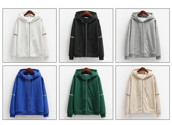 Női pulóver széles modell felirattal és zsebbel