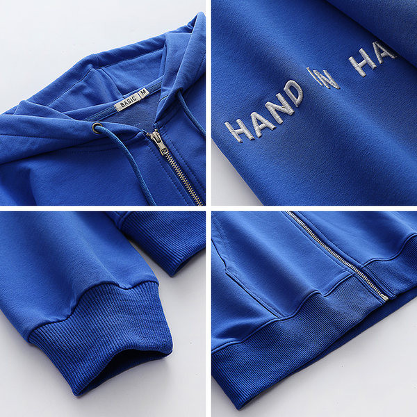 Női pulóver széles modell felirattal és zsebbel