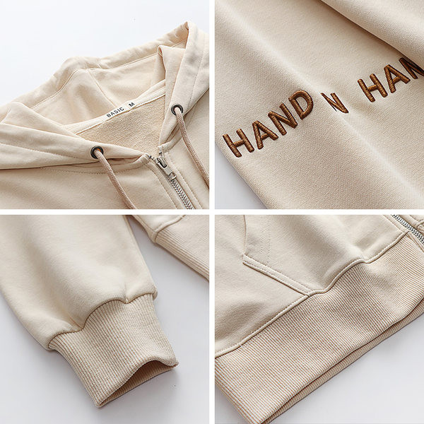 Bő női pulóver kapucnival és hímzett szöveggel