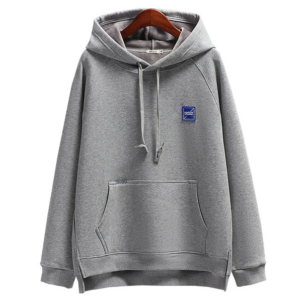 Női pulóver zsebbel és fűzővel