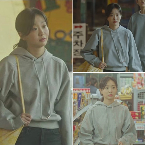 Szürke színű, kapucnival ellátott női pulóverek