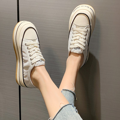 Stílusos női textil tornacipő fűzős felirattal