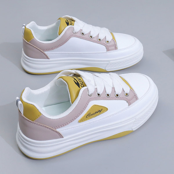 Moteriški sportbačiai su žalios ir violetinės spalvos raišteliais