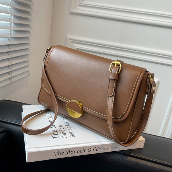 Uue mudeliga naiste nahast kott metallist lukuga