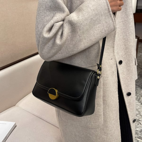 Uue mudeliga naiste nahast kott metallist lukuga