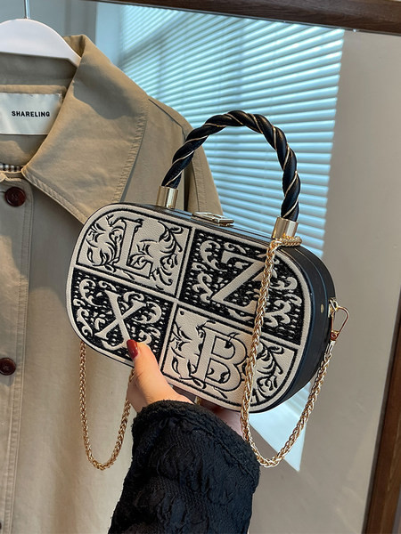 Moderni lagamino tipo rankinė su pečių grandinėle