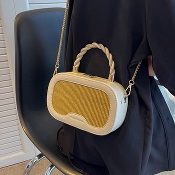 Γυναικεία δερμάτινη τσάντα τύπου βαλίτσας με μεταλλικό κούμπωμα