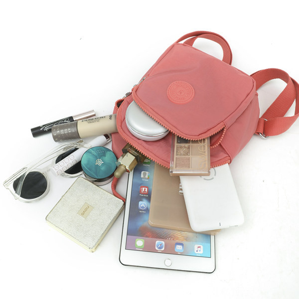 Tekstilinė moteriška kuprinė su keliais skyreliais