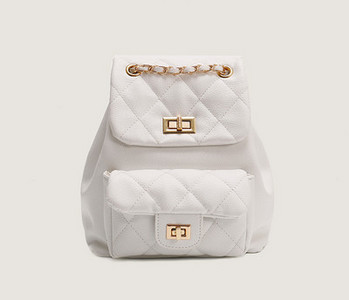 Kahes värvitoonis kuldsete motiividega naiste seljakott