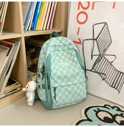 Naiste tekstiilist seljakott esitasku ja tõmblukuga