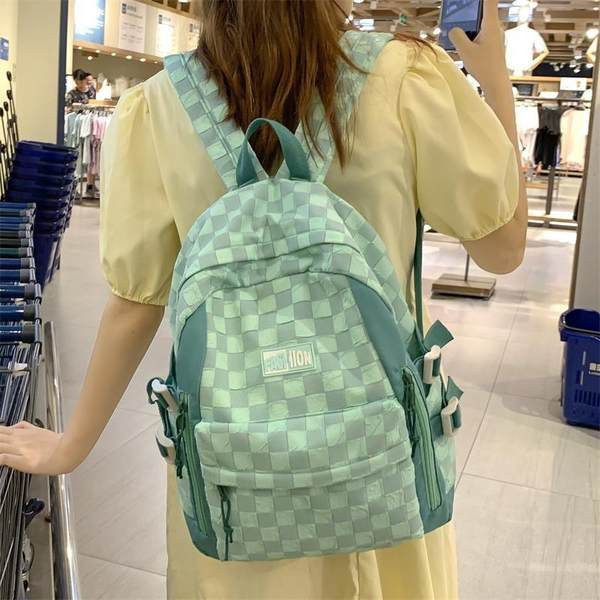 Naiste tekstiilist seljakott esitasku ja tõmblukuga