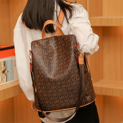 Madinga moteriška odinė kuprinė su užpakaline kišene ir užrašu