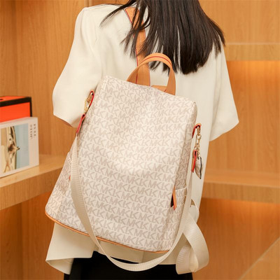 Madinga moteriška odinė kuprinė su užpakaline kišene ir užrašu