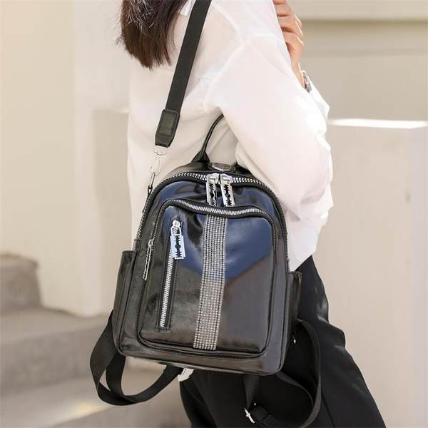 Lukkude ja dekoratiivkividega naiste seljakott