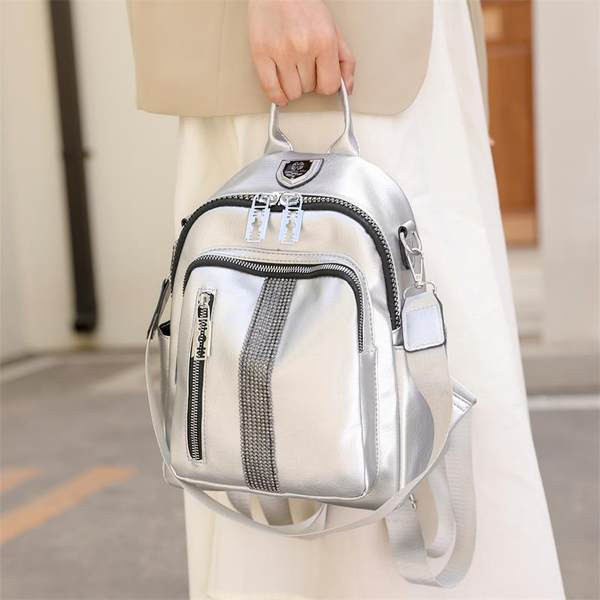 Lukkude ja dekoratiivkividega naiste seljakott