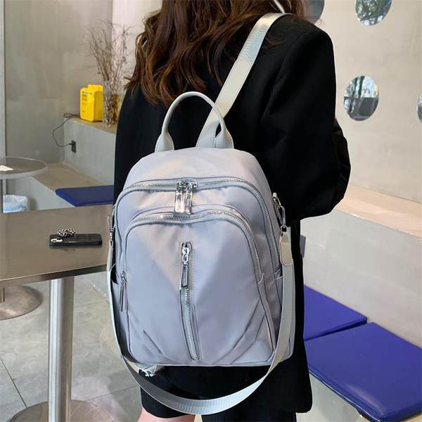 Neperšlampama moteriška keturių madingų spalvų kuprinė