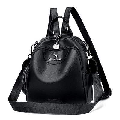 Kolmes värvitoonis naiste seljakott dekoratiivse metallelemendiga