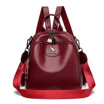 Kolmes värvitoonis naiste seljakott dekoratiivse metallelemendiga