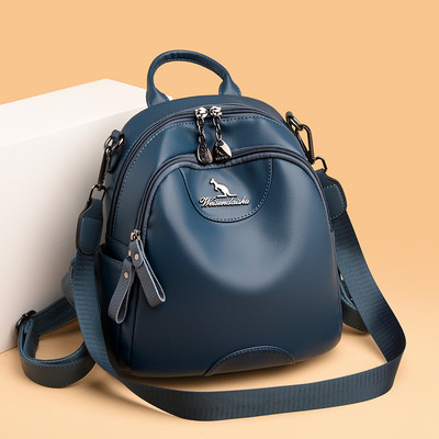 Kolmes värvitoonis naiste seljakott dekoratiivse metallelemendiga