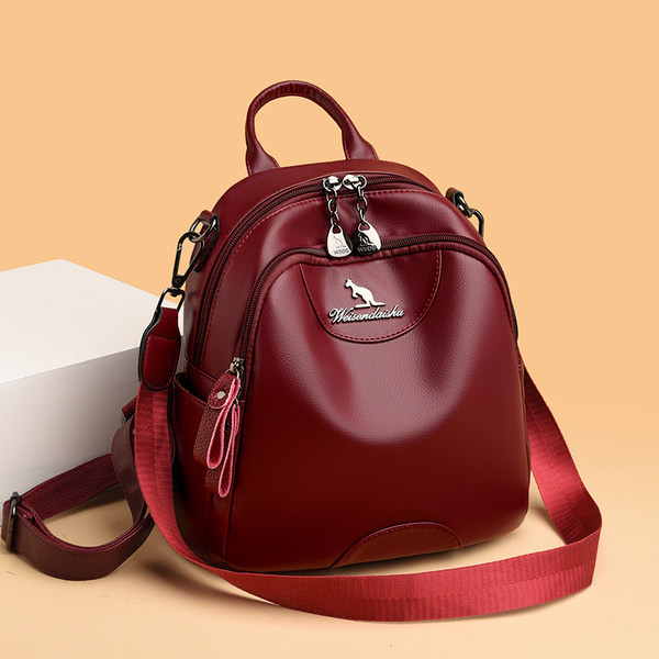 Kolmes värvitoonis naiste seljakott dekoratiivse metallelemendiga