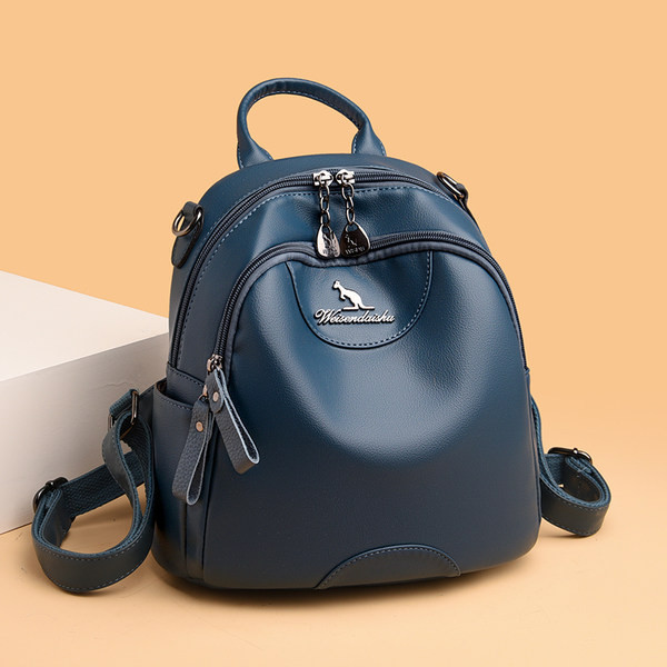 Kolmes värvitoonis naiste seljakott dekoratiivse metallelemendiga