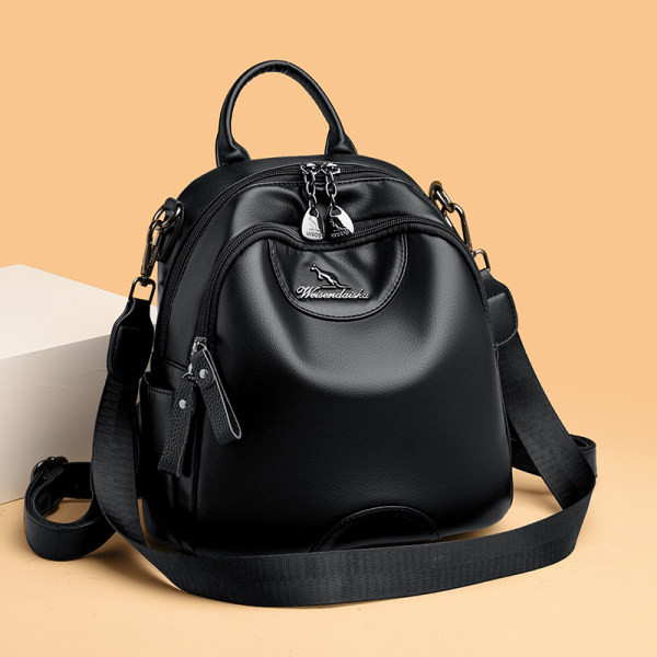 Kolmes värvitoonis naiste seljakott dekoratiivse metallelemendiga