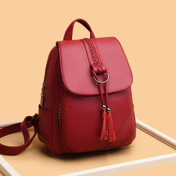 Γυναικείο δερμάτινο σακίδιο πλάτης με φούντες