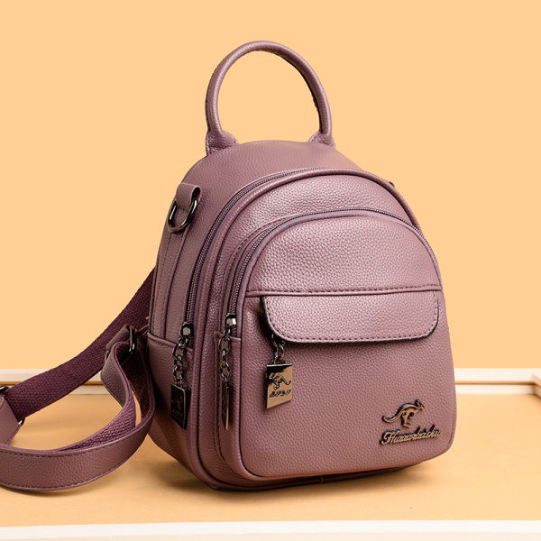 Šiuolaikinė moteriška kuprinė su metalo apdaila