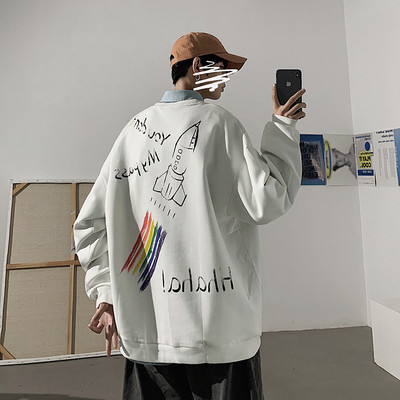 Įvairių spalvų džemperis su dekoratyvinėmis aplikacijomis