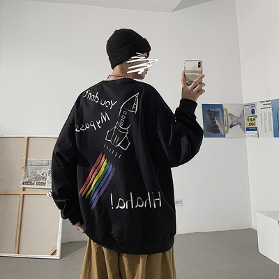 Įvairių spalvų džemperis su dekoratyvinėmis aplikacijomis