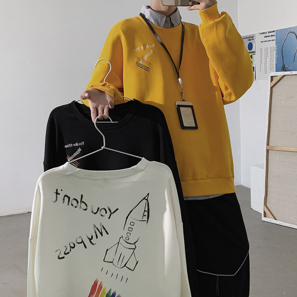 Įvairių spalvų džemperis su dekoratyvinėmis aplikacijomis